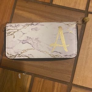 White marble print wallet with gold letter A